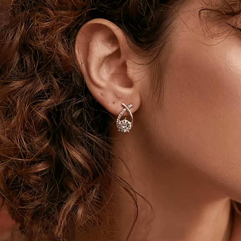 O&O - Golden Cross Zirconia Stud Earrings" can be rewritten as "O&O - Zirconia Stud Earrings with Golden Cross Design.