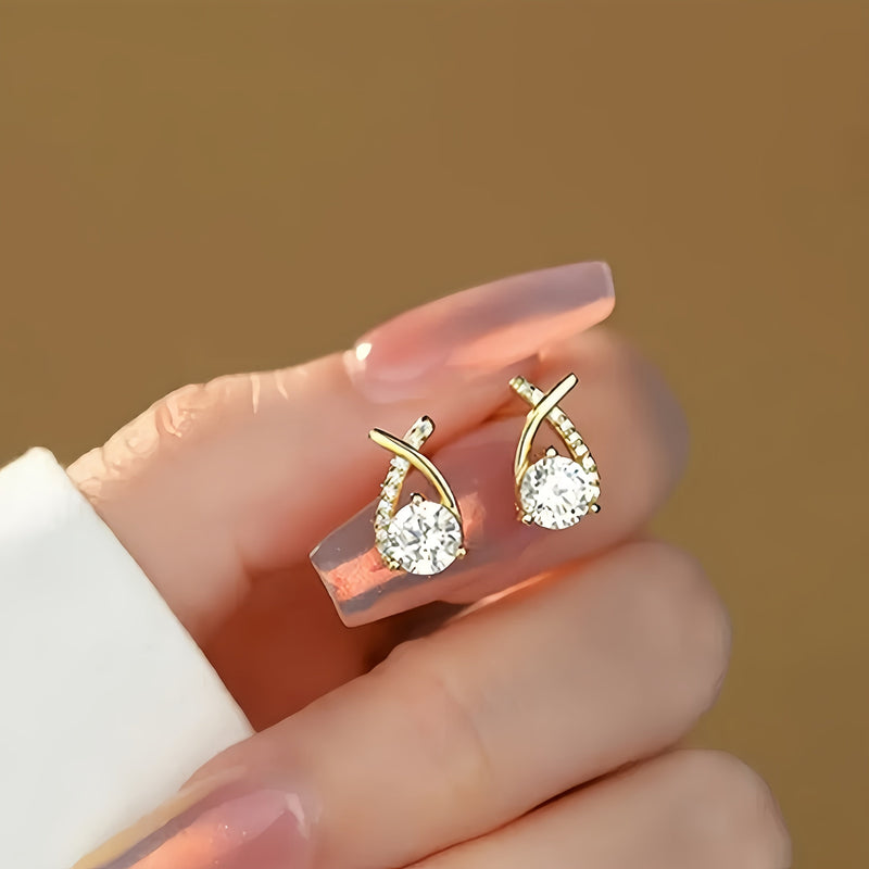 O&O - Golden Cross Zirconia Stud Earrings" can be rewritten as "O&O - Zirconia Stud Earrings with Golden Cross Design.