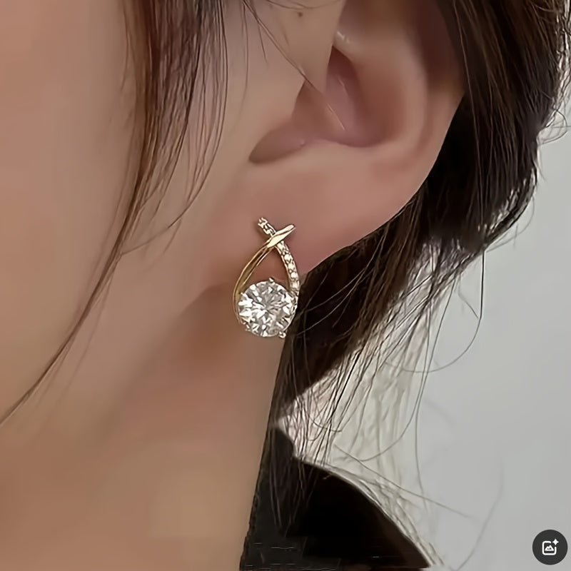 O&O - Golden Cross Zirconia Stud Earrings" can be rewritten as "O&O - Zirconia Stud Earrings with Golden Cross Design.
