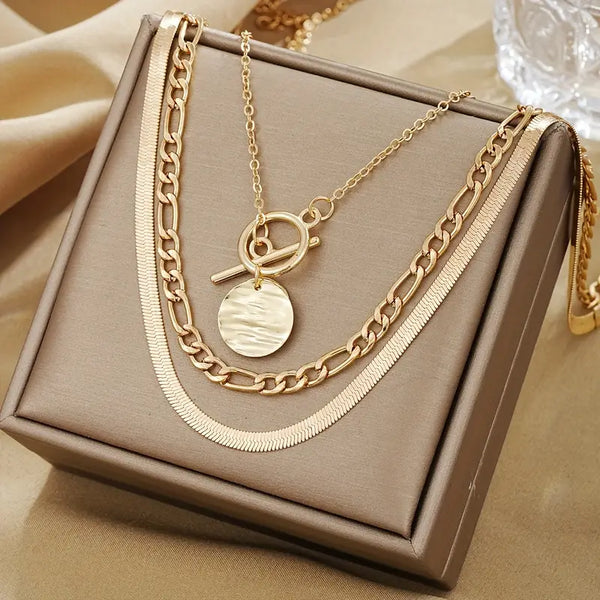 Gold Layered Necklace with Textured Coin Design by Savira